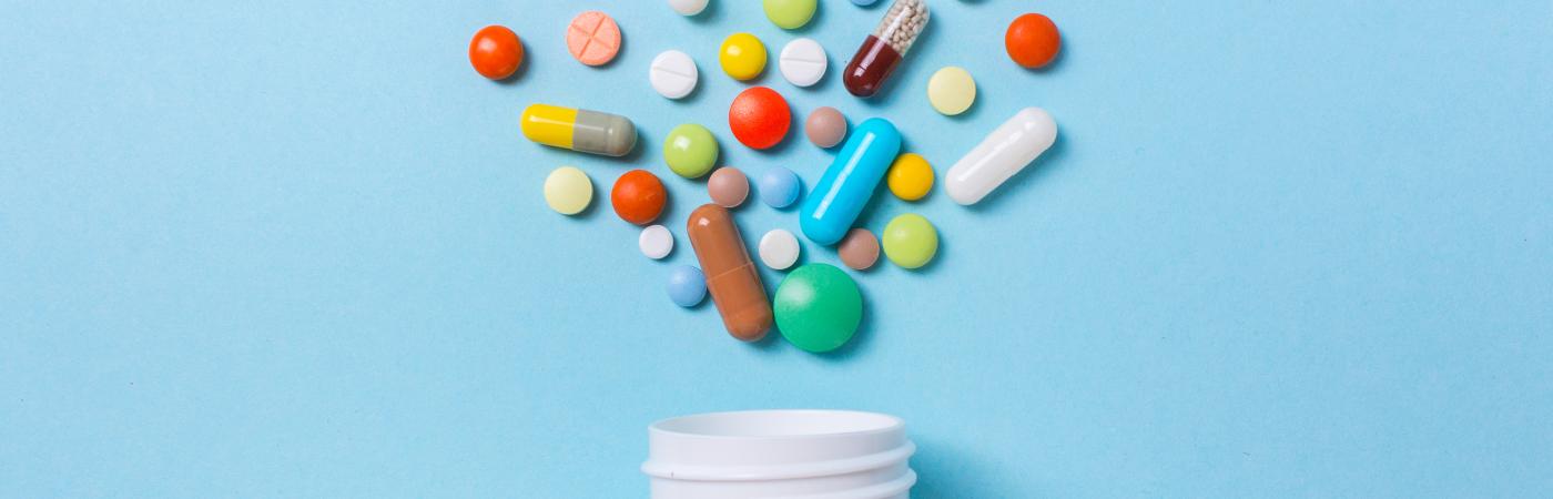 pills coming out of pill bottle