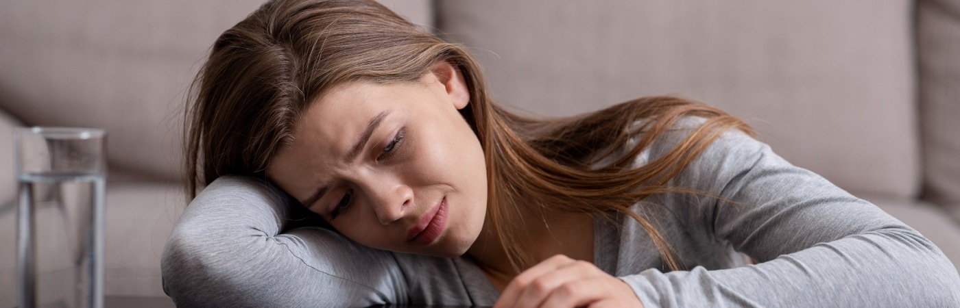 Depressed woman with pills