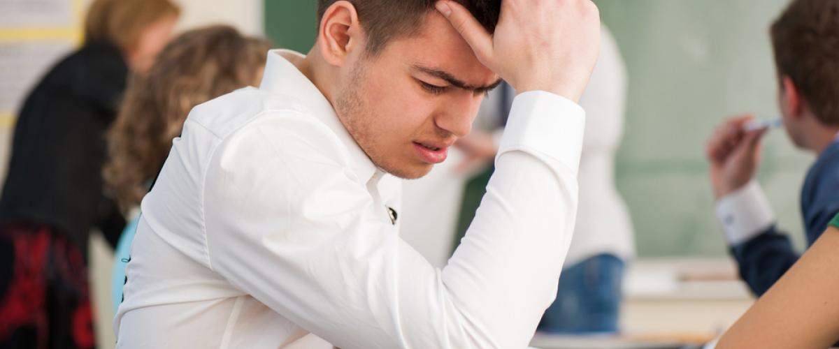 stressed out student at desk