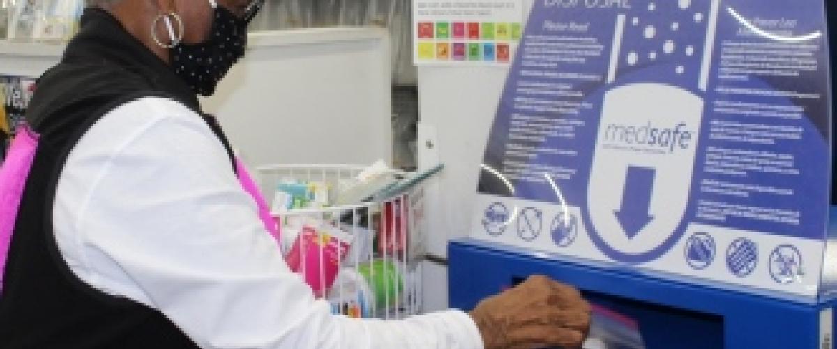 person depositing meds at drop off location