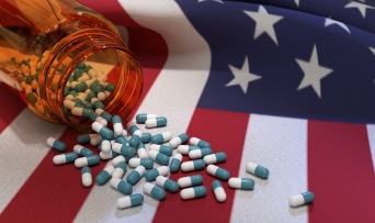 American flag with spilled pills