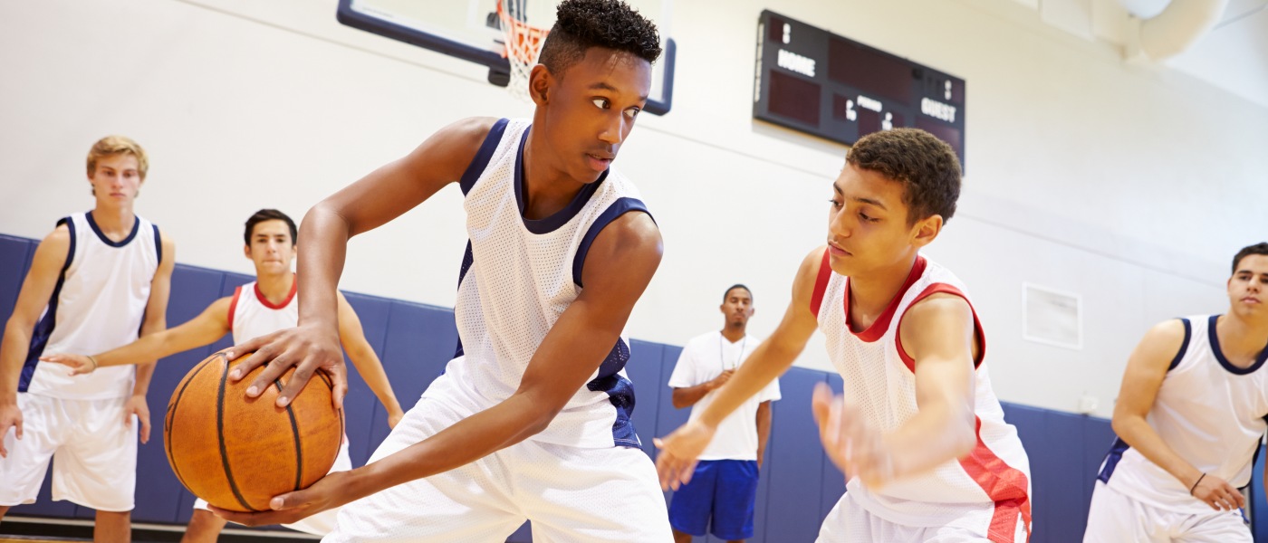 Teens play basketball