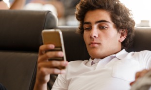 teen boy on cell phone
