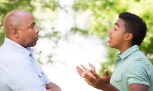 teen talking to father