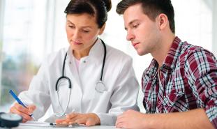 doctor talking to teen