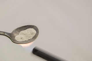 powder opioid in a spoon