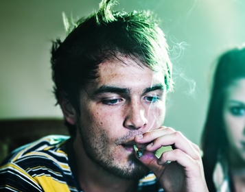 man smoking marijuana