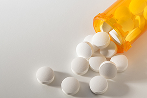 pills spilling out of bottle