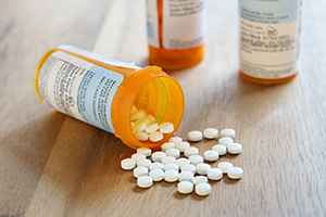 prescription pills and bottles on a table