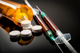 prescription pills and needles