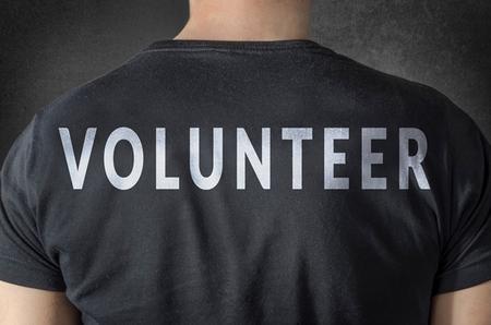 Volunteer at Substance Abuse Treatment Center/ Homeless Shelter man wearing a shirt that says 'volunteer'