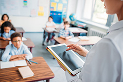 teacher with tablet